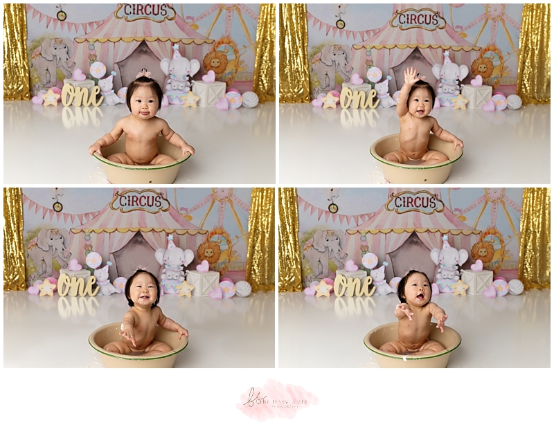 Girly circus themed cake smash with girl smiling in bubble bath